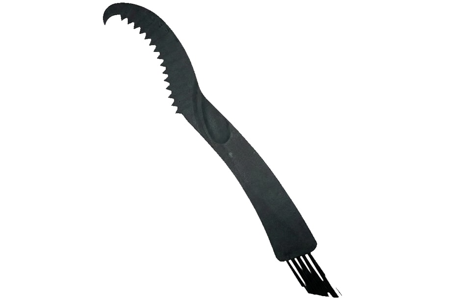 Escova de limpeza do cassete removendo sujeira entre os dentes